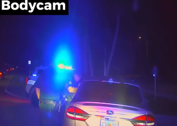 Officer pinned between two cars by drunk driver