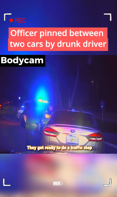 Officer pinned between two cars by drunk driver